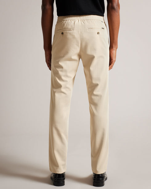RODNY-Trousers-Make an entrance in the RODNY trousers. Exquisitely tailored and an excellent addition to any man's wardrobe, this pair of trousers will make your mark on the boardroom. Trousers Slim fit Zip and button fastening Elasticated waist Pockets Braided piping Joseph is 6'1" / 1.85m and wears Navy in 32 R- Ted Baker Romania